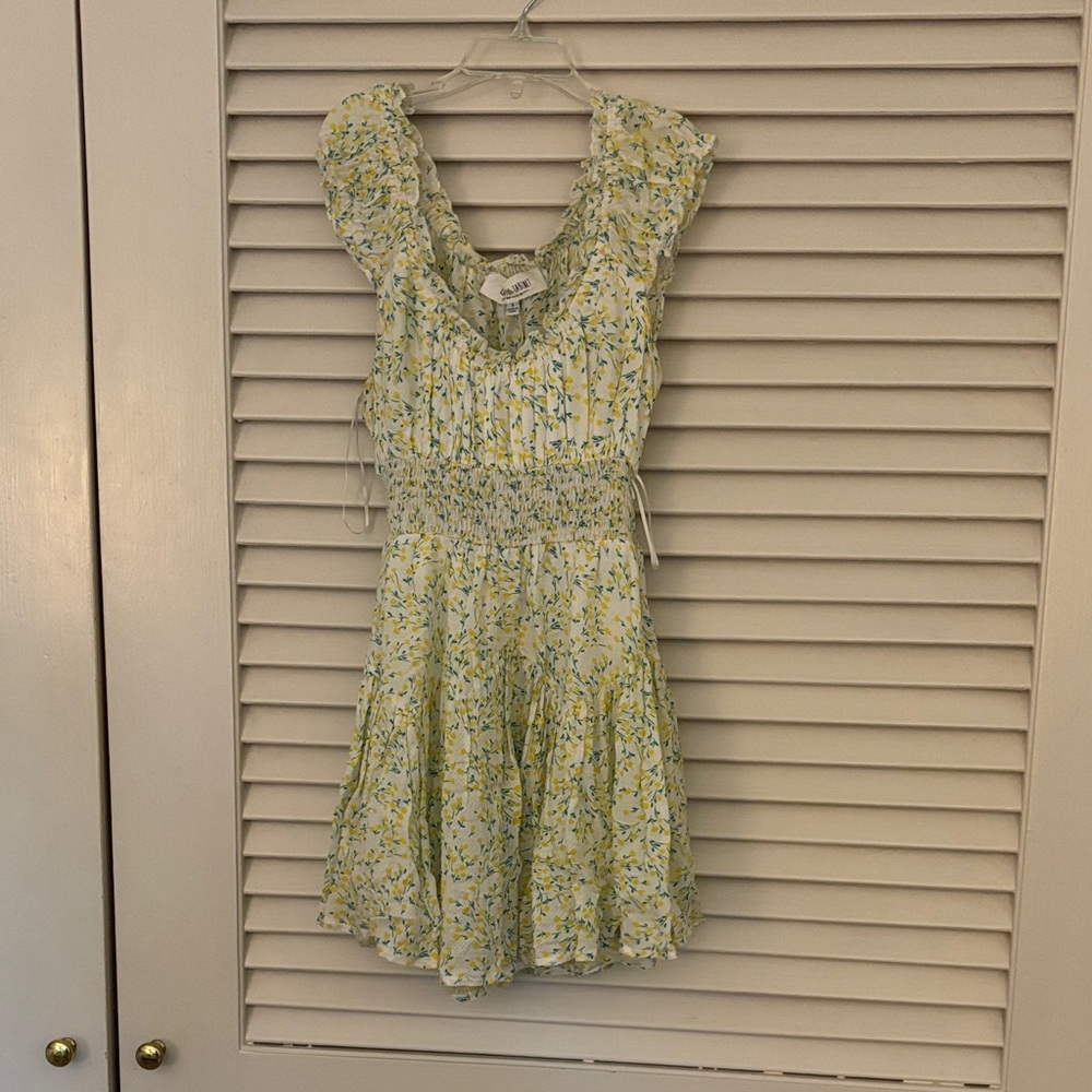 Isabelle’s Cabinet Floral Smocked Romper with Ruffle Sleeves